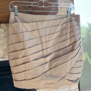 𝗡𝗪𝗢𝗧 Origami Fold Mini Skirt by Do + Be in tan from Sand + Charcoal